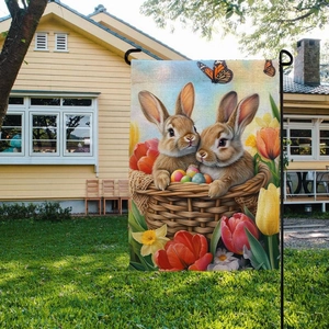 Easter garden flag with cute bunnies in a basket and spring flowers on green lawn