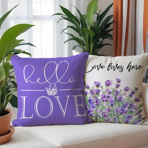 Lavender flower print pillowcases with hello love text on a white sofa in a bright room