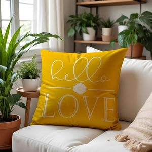 Linen sunflower cushion cover with hello LOVE print on a minimalist sofa with plants