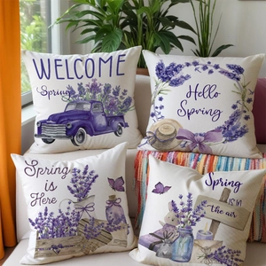 Close-up of four lavender flower pillow covers with rustic spring truck and wreath prints