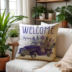 Linen lavender pillow cover with vintage truck and Welcome Spring text on white sofa