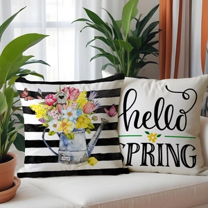 Detail of floral spring cushion covers with tulip motifs and hello spring text design