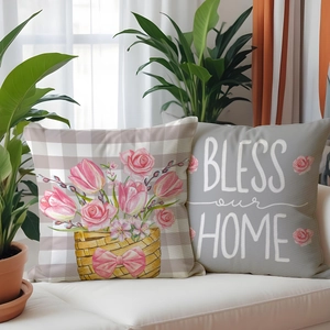 Detail showing spring floral tulip pattern and Bless our Home text on linen cushion covers
