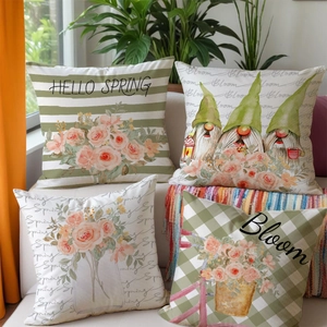 Detail of four spring theme throw pillow covers with gnome and floral print on sofa