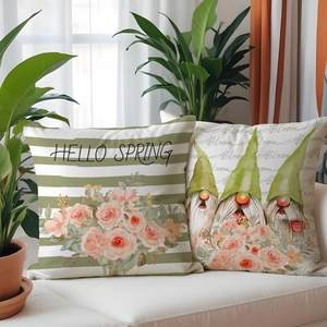 Close-up of spring pillow covers with Hello Spring text and cute gnome floral prints