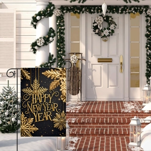 Macro detail of Happy New Year garden flag with gold snow pattern on a black background