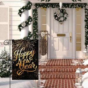 Close-up of Happy New Year garden flag with gold fireworks and metal stand in snowy yard