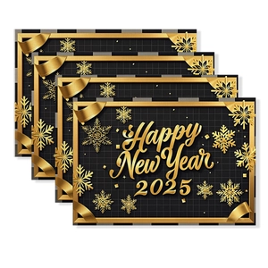 Detail of luxury black and gold Happy New Year 2025 placemats with gold snowflakes