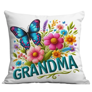 Close-up of floral embroidery texture and Grandma text on a white cushion cover