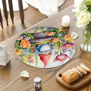 Macro detail of round burlap placemat with garden gnome and flower printing on dark wood table