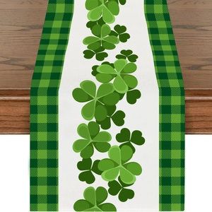 Macro detail of St. Patrick's Day table runner with green shamrock prints and checkered edges