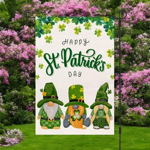 St. Patrick's Day garden flag with three gnomes and clover patterns in a lush yard