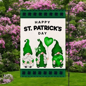 St. Patrick's Day garden flag with gnomes and clovers on a black metal pole in a park