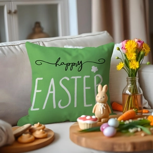 Easter decorative pillow case with green fabric and happy EASTER print on a sofa