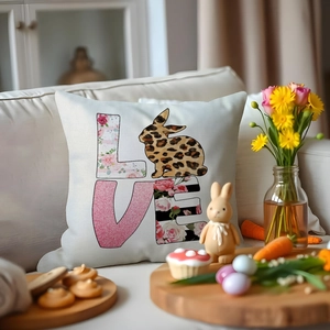 Easter bunny LOVE pillow cover on a cozy sofa with decorative spring holiday elements