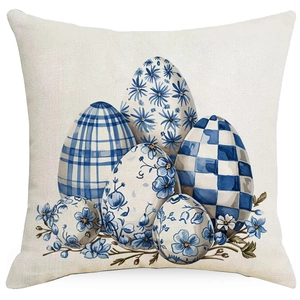 Detail of blue Easter egg pattern with floral designs on a beige linen pillowcase