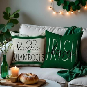 Detail of St. Patrick's Day shamrock pillow covers on a cozy sofa with green decor