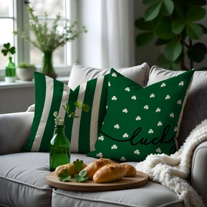 Detail of St. Patrick's Day pillow covers with lucky clover and green striped designs