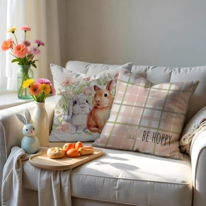 Detail of Easter floral bunny pillows and pink plaid cushion covers on a sofa