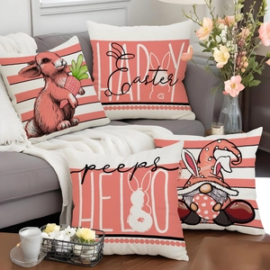 Set of four Easter pillow covers with bunny and gnome prints on a gray sofa