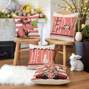 Set of 4 pink Easter rabbit pillow covers with cartoon prints on a wooden chair