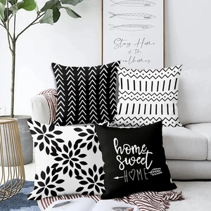 Set of four black and white modern geometric and floral pattern decorative sofa pillow covers