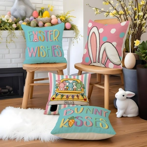 Detailed view of four linen Easter pillowcases featuring bunny ears and holiday wishes