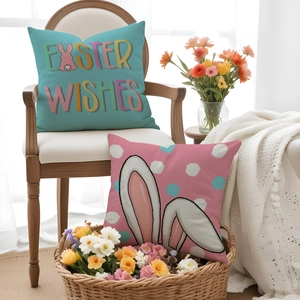 Close-up of Easter linen cushion covers with rabbit prints and Easter Wishes text