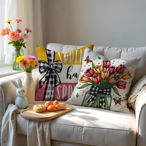 Close-up of spring tulip pillow covers with floral patterns and plaid bow details
