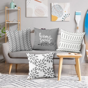 Set of four gray and white Nordic cushion covers with home sweet home and geometric prints