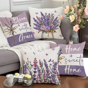 Detailansicht von vier Lavendel-Kissenbezügen aus Leinen auf einem grauen Sofa