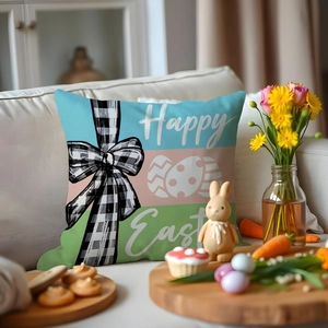 Detail of Happy Easter pillow cover featuring plaid bow and colorful eggs on white sofa