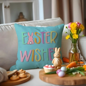 Light blue Easter Wishes pillow cover with bunny print on white sofa with decor