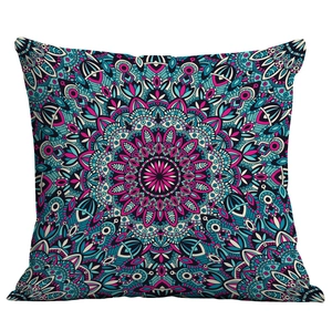 Close-up of bohemian mandala pillowcase with vibrant pink and teal geometric art patterns