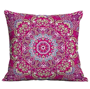 Close-up of vibrant mandala throw pillow with intricate geometric patterns in rose and teal