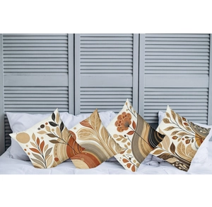 Close-up of four bohemian cushion covers with sunset patterns on a white bed