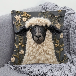 Valais Blacknose Sheep pillow cover with 3D embroidery on a modern grey sofa