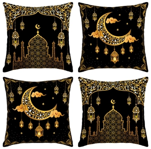 Detailed view of four golden Islamic patterns with crescent moon and stars on black pillowcase