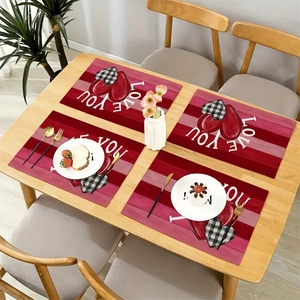 Macro detail of four red Valentine's Day placemats with Love You heart patterns
