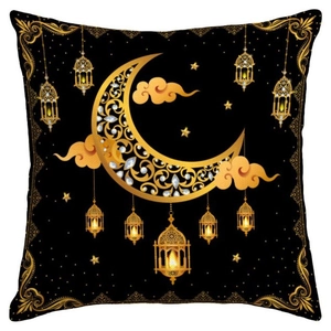 Detail of Ramadan cushion cover with golden moon, lanterns and stars on black linen
