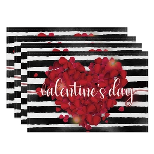 Detail view of 4-piece set Valentine's Day placemats with red heart and stripes