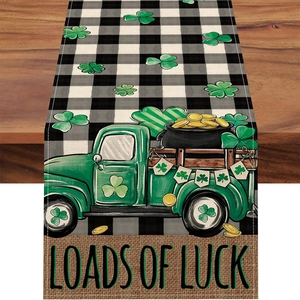 Detail of St. Patrick's table runner showing lucky truck and loads of luck text on linen