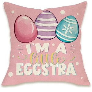 Detail of pink Easter cushion cover with Easter eggs and 'I'M A little EGGSTRA' text