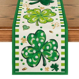 St. Patrick's Day table runner with green clovers and gold coins on dark wood table