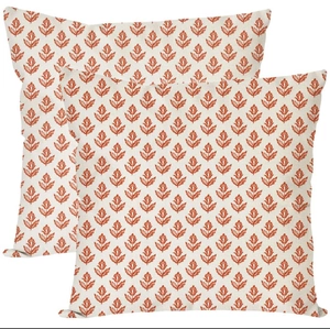 Set of 2 square linen pillow covers with orange floral patterns on creamy background