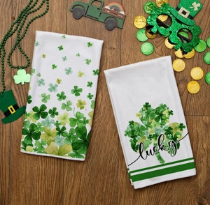 Macro shot of St. Patrick's Day towels with green shamrock prints and lucky text design