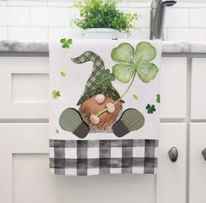 Detail of St. Patrick's Day kitchen towel with festive gnome and shamrock patterns