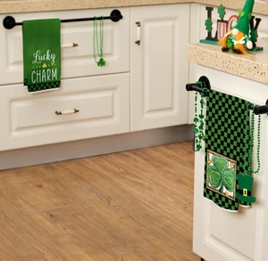 Detail of St. Patrick's Day towels with Lucky Charm text and green shamrock bead garland