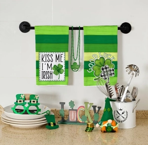 Detail showing St. Patrick's Day kitchen towels with Irish lucky clover and slogan design