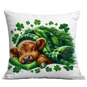 Close-up detail of a sleeping highland cow and green clover on a St. Patrick's Day pillowcase